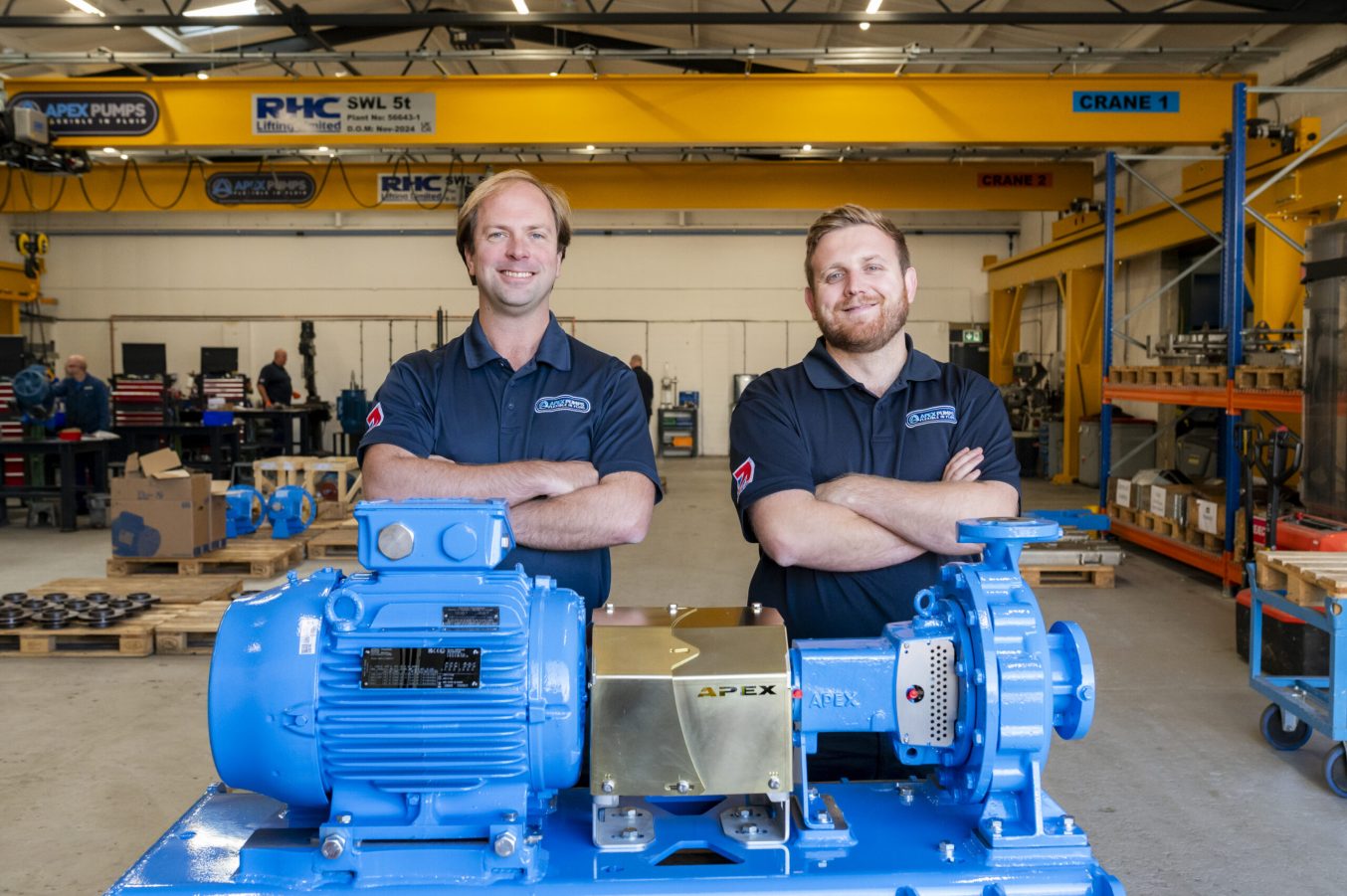 two men in apex pumps uniforms with a centrifugal pump